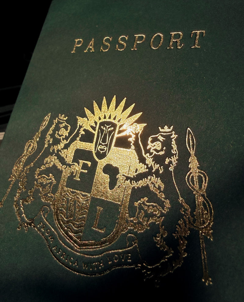 Close-up of a passport with gold embossed design and text.
