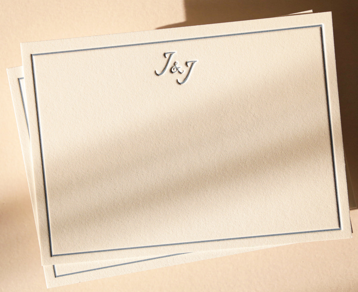 Beige stationery with 'J&J' monogram on a beige background
